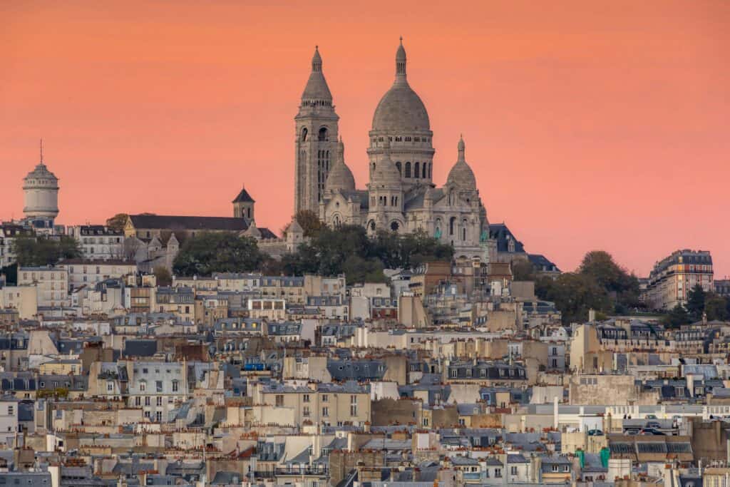 Montmartre at Sunset - 1 Day in Paris Itinerary for Families Sunset view over Montmartre and Sacré-Cœur Basilica, perfect ending to a 1 day in Paris itinerary for families.